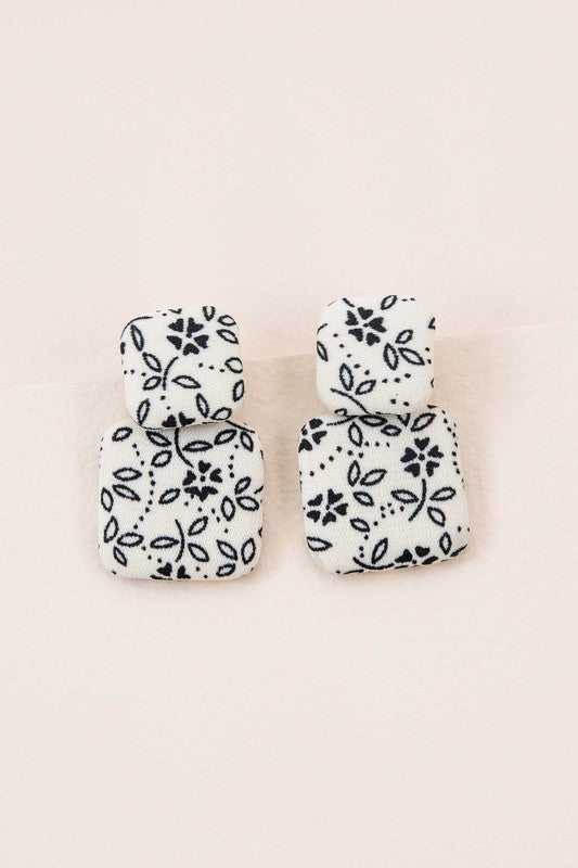 Textile Drop Earrings with a retro design featuring a black and white checkered pattern on a beige background.