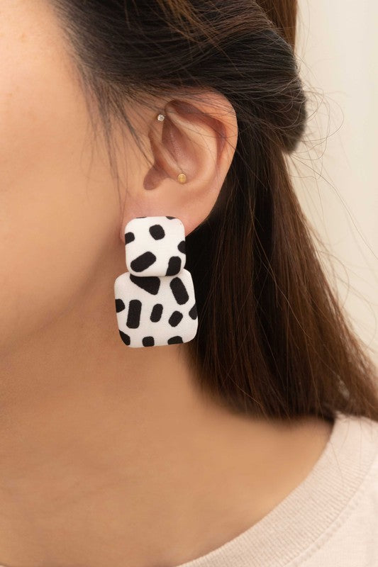 Textile Drop Earrings with a retro design featuring a black and white checkered pattern on a beige background.