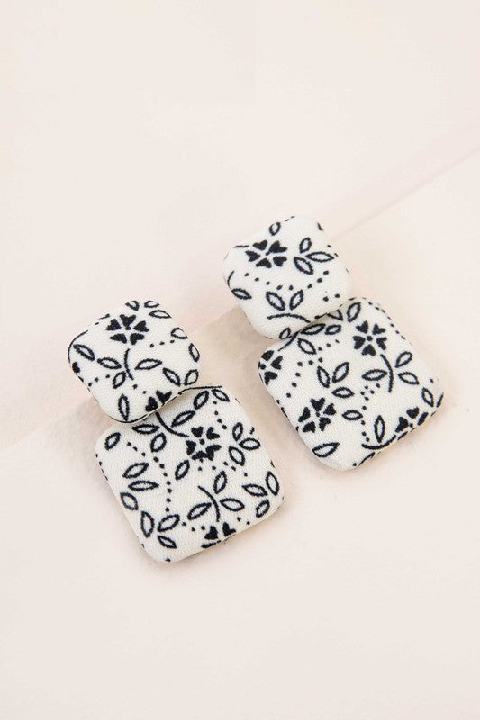 Textile Drop Earrings with a retro design featuring a black and white checkered pattern on a beige background.