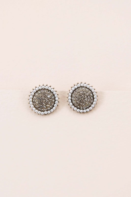 The Refined Stud Earrings showcase vintage gold metal centers encircled by pearls, all set against a light beige backdrop.