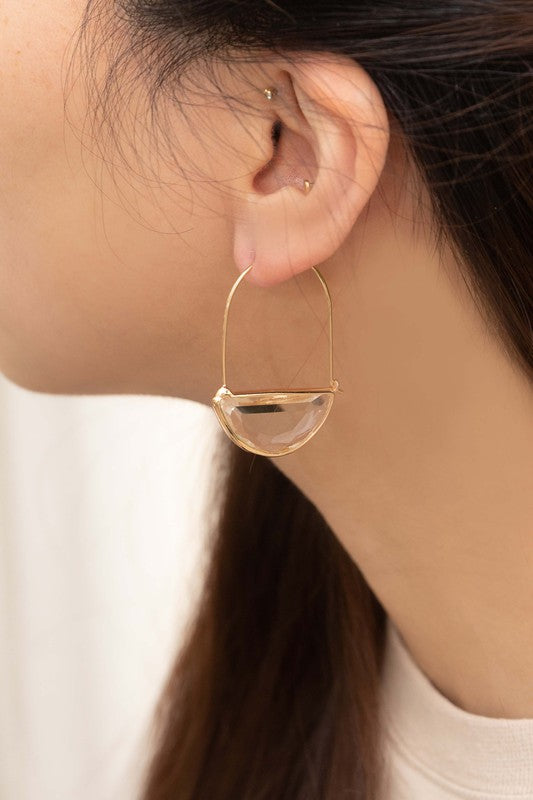 Glacier Hoop Earrings in 10k gold plating feature semi-circle emerald green stones, elegantly displayed on a light beige surface.