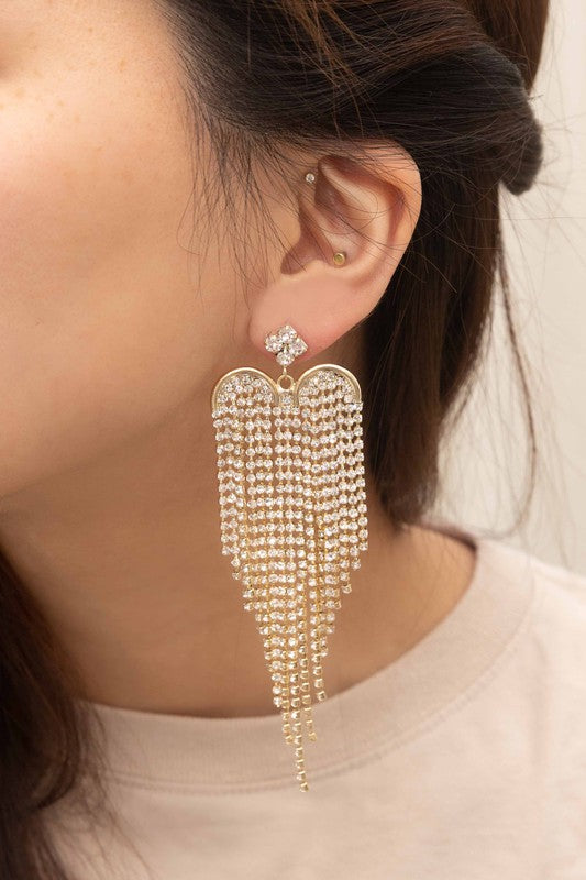 The Heartbreaker Dangle Earrings feature a cascading design embellished with rhinestones, beautifully plated in 10k gold.