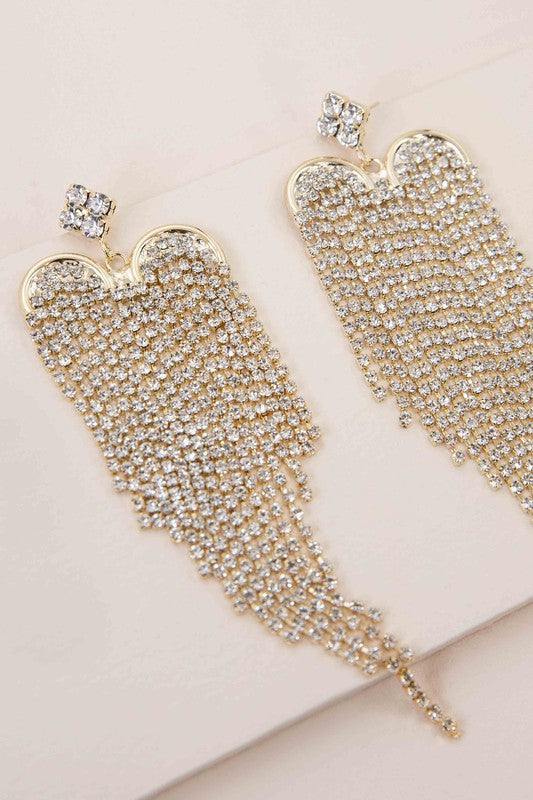 The Heartbreaker Dangle Earrings feature a cascading design embellished with rhinestones, beautifully plated in 10k gold.