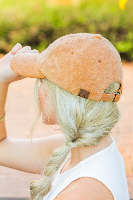 Woman wearing a CC Terry Cloth Baseball Hat backwards with a fishtail braid.