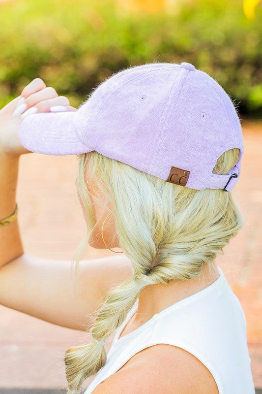 Woman wearing a CC Terry Cloth Baseball Hat backwards with a fishtail braid.
