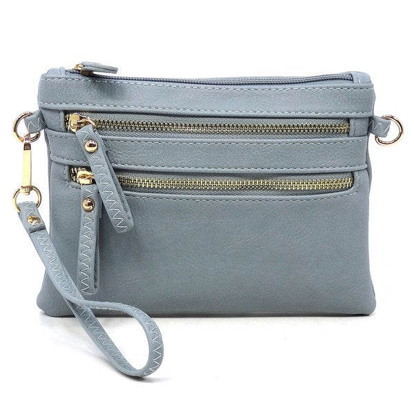 The Fashion Clutch & Cross Body Bag in lavender chic faux leather boasts three zippered compartments and a detachable strap, effortlessly transforming into a stylish fashion clutch for any occasion.