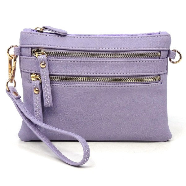 The Fashion Clutch & Cross Body Bag in lavender chic faux leather boasts three zippered compartments and a detachable strap, effortlessly transforming into a stylish fashion clutch for any occasion.