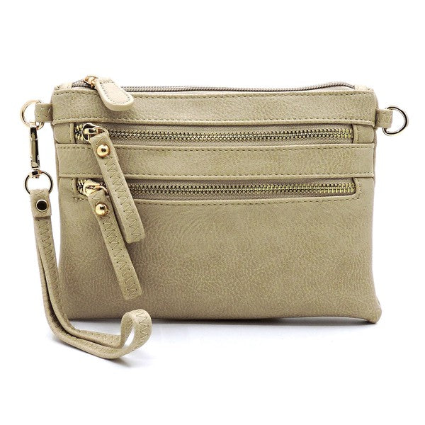 The Fashion Clutch & Cross Body Bag in lavender chic faux leather boasts three zippered compartments and a detachable strap, effortlessly transforming into a stylish fashion clutch for any occasion.