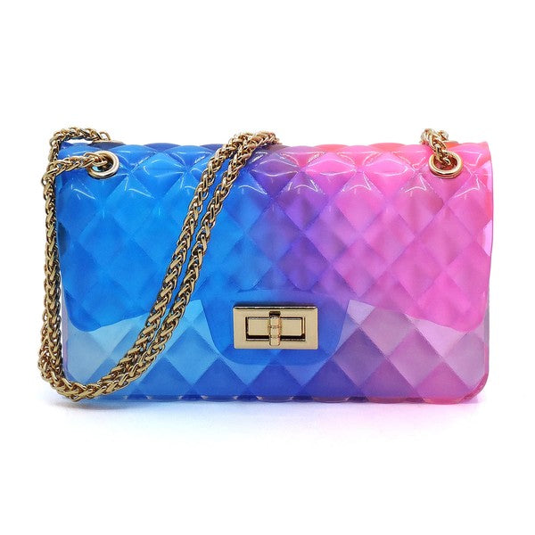 The Quilt Embossed Multi Color Jelly Shoulder Bag features a quilted gradient design transitioning from pink to yellow, adorned with gold-tone hardware that includes a rectangular gold clasp and chain strap.