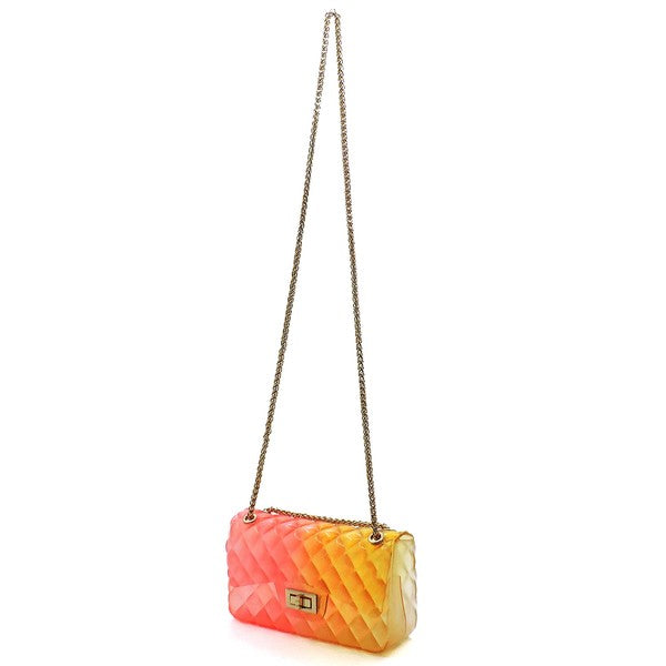 The Quilt Embossed Multi Color Jelly Shoulder Bag features a quilted gradient design transitioning from pink to yellow, adorned with gold-tone hardware that includes a rectangular gold clasp and chain strap.