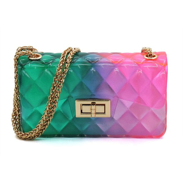 The Quilt Embossed Multi Color Jelly Shoulder Bag features a quilted gradient design transitioning from pink to yellow, adorned with gold-tone hardware that includes a rectangular gold clasp and chain strap.