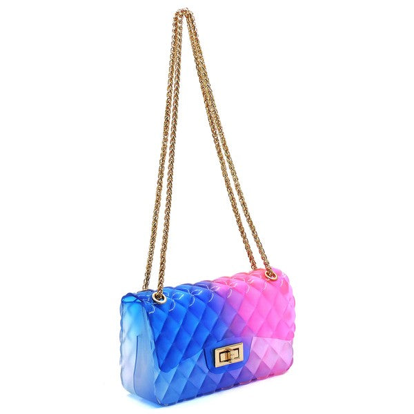 The Quilt Embossed Multi Color Jelly Shoulder Bag features a quilted gradient design transitioning from pink to yellow, adorned with gold-tone hardware that includes a rectangular gold clasp and chain strap.