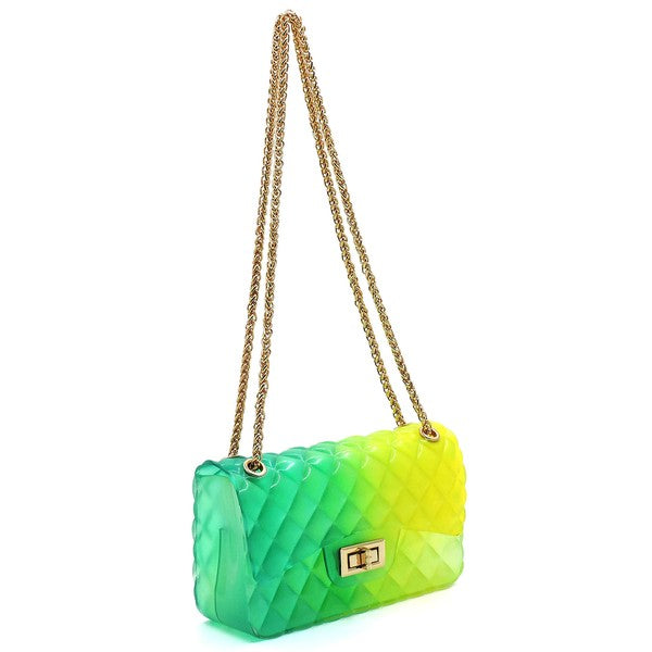 The Quilt Embossed Multi Color Jelly Shoulder Bag features a quilted gradient design transitioning from pink to yellow, adorned with gold-tone hardware that includes a rectangular gold clasp and chain strap.