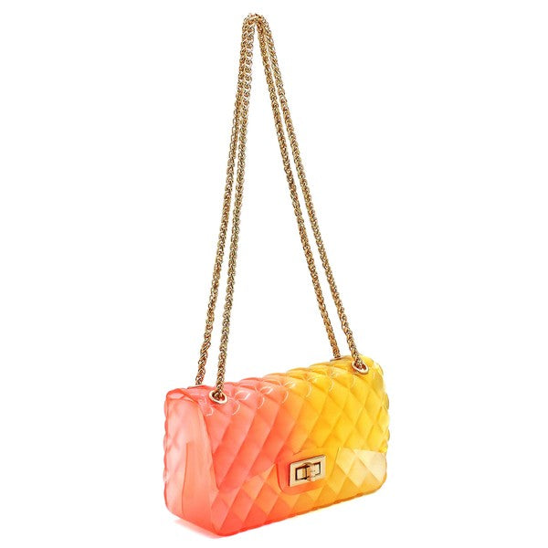 The Quilt Embossed Multi Color Jelly Shoulder Bag features a quilted gradient design transitioning from pink to yellow, adorned with gold-tone hardware that includes a rectangular gold clasp and chain strap.