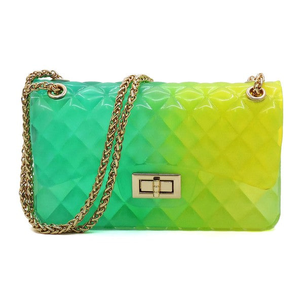 The Quilt Embossed Multi Color Jelly Shoulder Bag features a quilted gradient design transitioning from pink to yellow, adorned with gold-tone hardware that includes a rectangular gold clasp and chain strap.