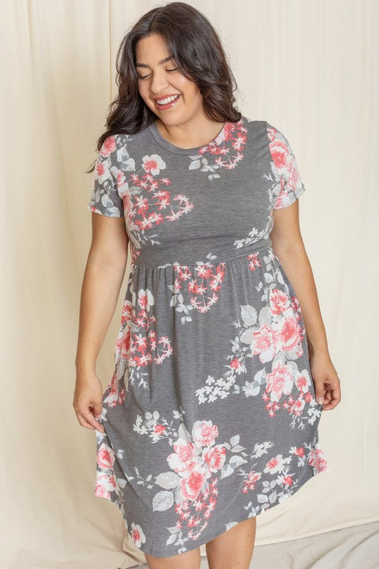 A person wearing the Vintage Floral Midi Dress smiles while standing indoors.