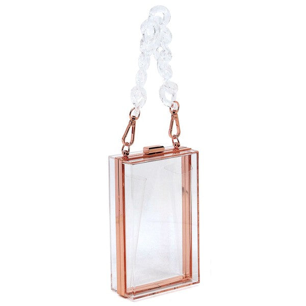 The Acrylic Chain Handle See Thru Crossbody Clutch is a rectangular pink acrylic crossbody clutch that features a sleek gold chain strap and a detachable shoulder chain, highlighted by an elegant pink acrylic chain handle.