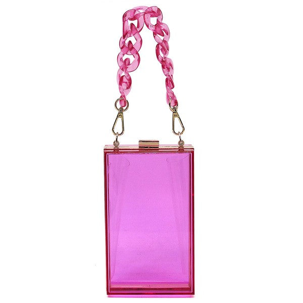 The Acrylic Chain Handle See Thru Crossbody Clutch is a rectangular pink acrylic crossbody clutch that features a sleek gold chain strap and a detachable shoulder chain, highlighted by an elegant pink acrylic chain handle.