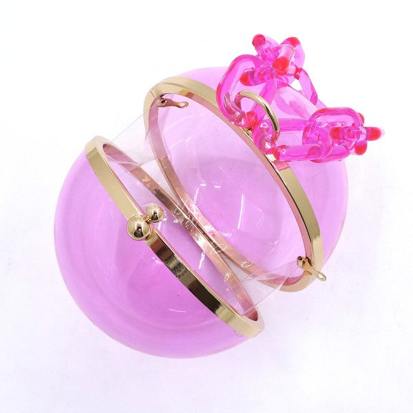 Introducing the Acrylic Chain Handle See Thru Ball Crossbody Bag, an orange round handbag with a transparent body, featuring an elegant acrylic chain handle and gold-tone hardware.