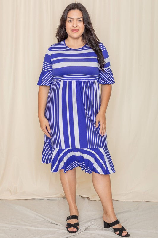 A person wearing a Plus Mix Stripe Ruffle Midi Dress stands against a beige background, smiling.