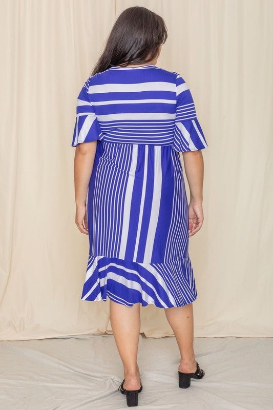 A person wearing a Plus Mix Stripe Ruffle Midi Dress stands against a beige background, smiling.