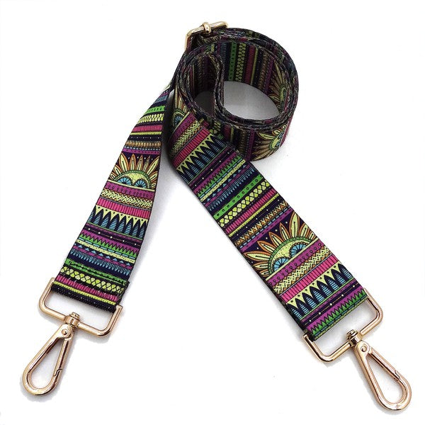 A coiled Fashion Rainbow Print Shoulder Strap that features vibrant colors and adjustable length, complete with gold clips on each end.