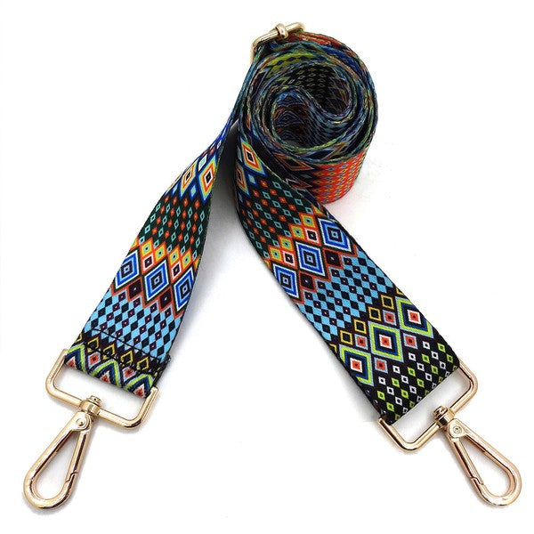 A coiled Fashion Rainbow Print Shoulder Strap that features vibrant colors and adjustable length, complete with gold clips on each end.