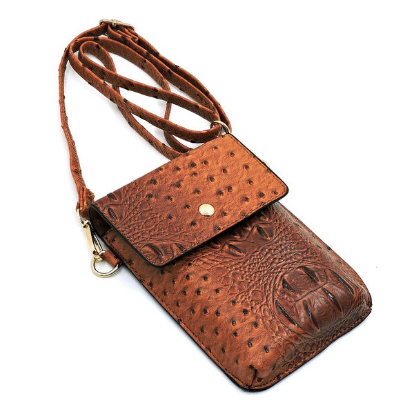 Ostrich Croc Crossbody Cell Phone Case made from red faux vegan leather, featuring a snap button closure, detachable shoulder strap, and gold hardware.