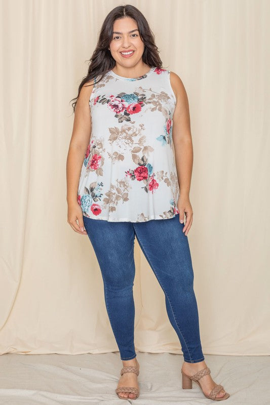 A person wearing a Plus Floral tunic smiles, standing against a light-colored background of ivory plus fabric.