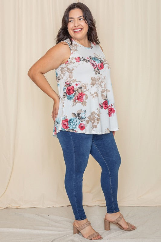 A person wearing a Plus Floral tunic smiles, standing against a light-colored background of ivory plus fabric.