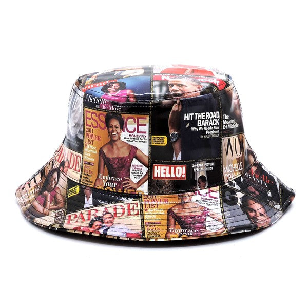 Introducing the Magazine Cover Collage Hat, a chic bucket hat available in one size. It showcases vibrant magazine covers depicting a woman in various poses and outfits, and is adorned with faux vegan leather accents for a perfect fusion of bold style and eco-friendly sophistication.