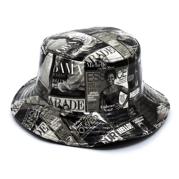 Introducing the Magazine Cover Collage Hat, a chic bucket hat available in one size. It showcases vibrant magazine covers depicting a woman in various poses and outfits, and is adorned with faux vegan leather accents for a perfect fusion of bold style and eco-friendly sophistication.