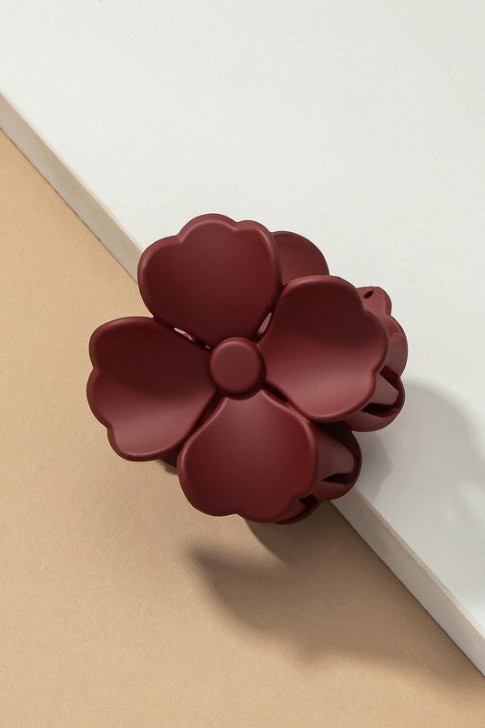 An elegant display of Matte Color Coated Flower Hair Claw Clips in soft Morandi shades is beautifully organized on a beige surface, creating a peaceful and fashionable look.