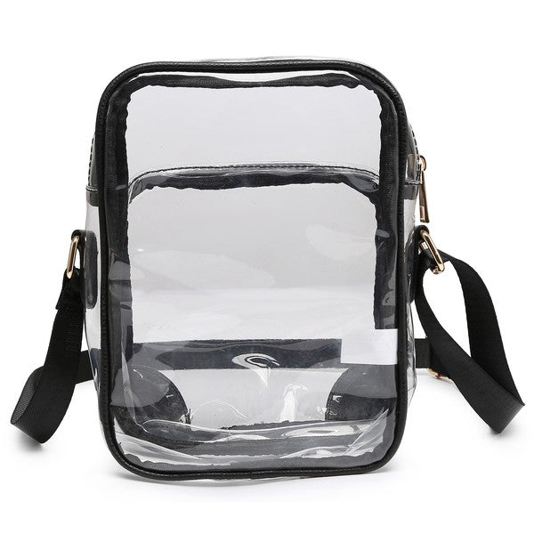 The See Thru Multi Compartment Crossbody Bag is a small, clear rectangular crossbody bag with blue trim and an adjustable blue shoulder strap. Made from faux leather, it features gold zipper closures on two compartments.