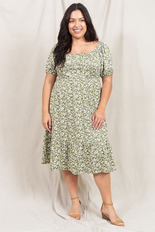 A person wearing the Paisley Floral Square Neck Puff Sleeve Boho Dress stands on a light-colored backdrop.