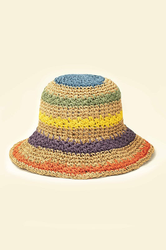 Three vibrant Packable crochet straw bucket hats with multi-color stripes are stacked elegantly on a plain background.