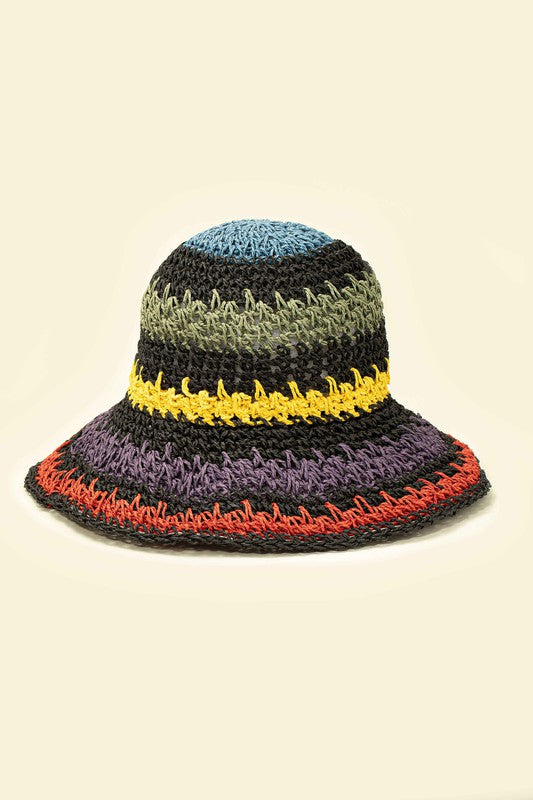 Three vibrant Packable crochet straw bucket hats with multi-color stripes are stacked elegantly on a plain background.