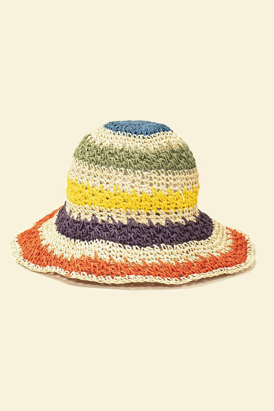 Three vibrant Packable crochet straw bucket hats with multi-color stripes are stacked elegantly on a plain background.