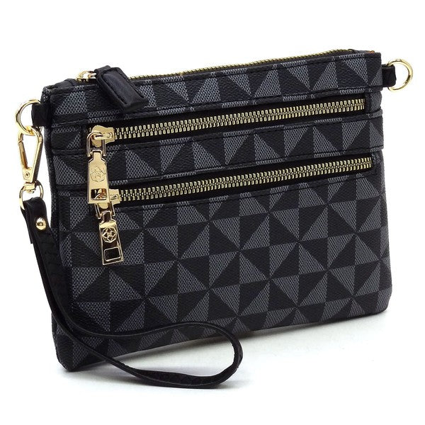 The Monogram Multi Zip Clutch Crossbody Bag Wristlet is a compact clutch with a geometric black and white triangle pattern, featuring a brown vegan leather wrist strap and gold zippers.