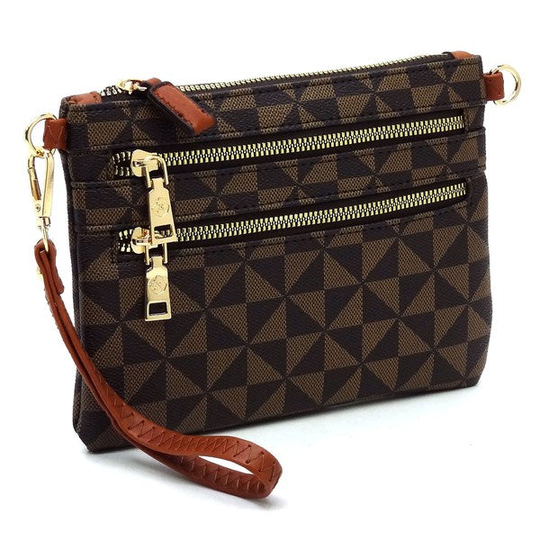 The Monogram Multi Zip Clutch Crossbody Bag Wristlet is a compact clutch with a geometric black and white triangle pattern, featuring a brown vegan leather wrist strap and gold zippers.