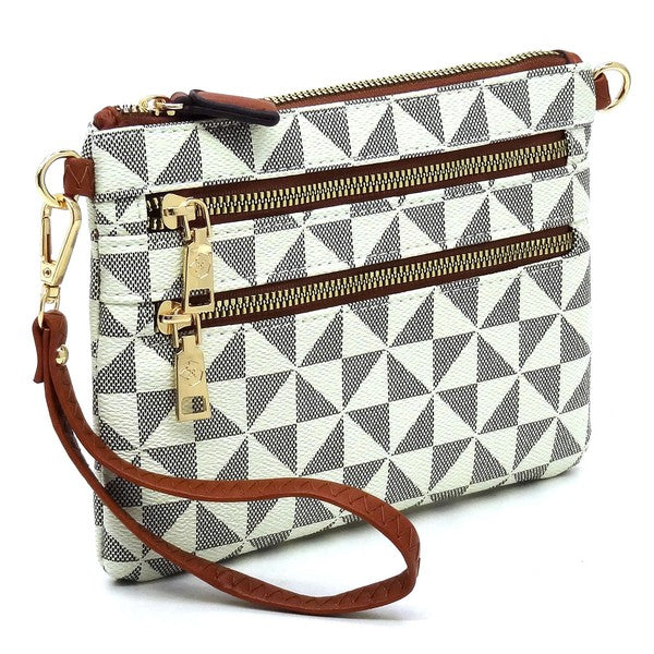 The Monogram Multi Zip Clutch Crossbody Bag Wristlet is a compact clutch with a geometric black and white triangle pattern, featuring a brown vegan leather wrist strap and gold zippers.