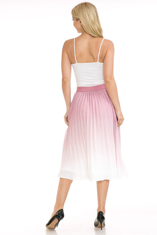 A woman with long blonde hair wears a black sleeveless top paired with the Women's High Waist Pleated A-Line Swing skirt featuring a purple to white gradient pleat and black ballet flats. She poses with one arm slightly bent and the other at her side.