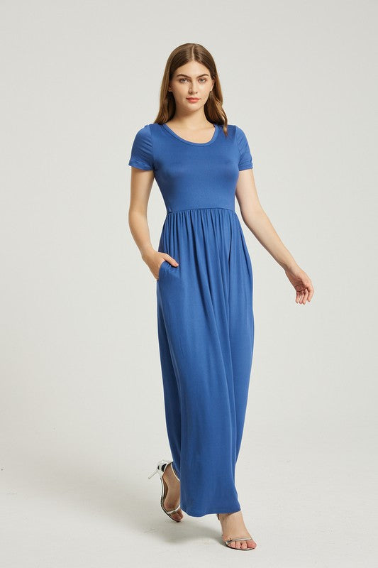 Someone walks across a plain background wearing the Women's Summer Casual Maxi Dress With Pocket, showcasing its solid pattern and short sleeves. Paired with white heels, this dress combines fashion and function with its convenient pocket design.