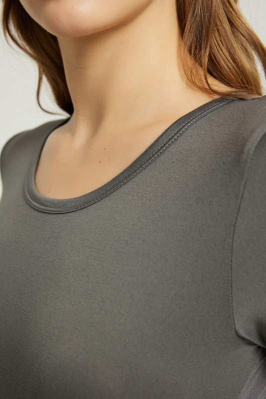 A woman in a grey Women's Summer Casual Maxi Dress With Pocket, featuring an A-line silhouette and chic pocket style, stands with her hands in her pockets against a plain background. She is wearing light-colored sandals.