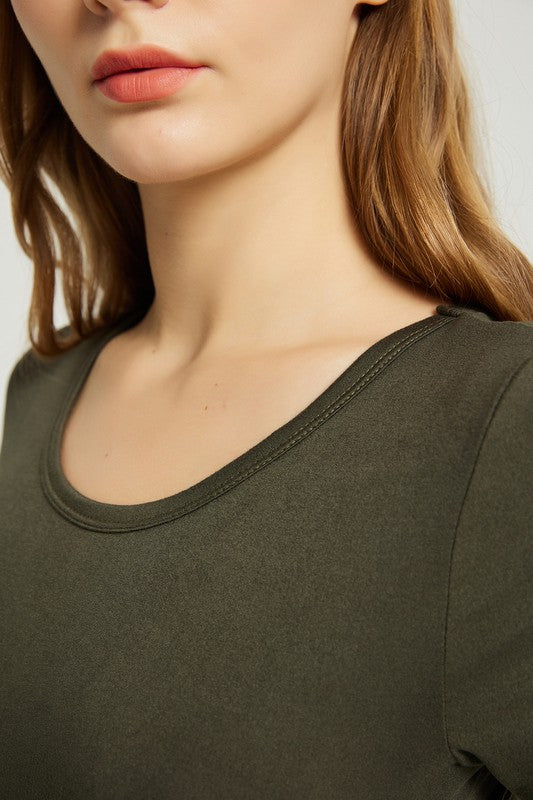 A person with straight hair is wearing a short-sleeved, floor-length dark green Women's Summer Casual Maxi Dress With Pocket and beige high-heeled sandals. They are standing against a plain white background.