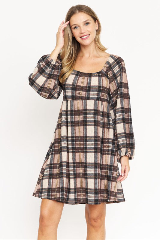 A woman in the Plaid Balloon Sleeve Midi Dress, featuring a square neckline and crafted from polyester spandex, is smiling and standing against a light background. Made in the United States.