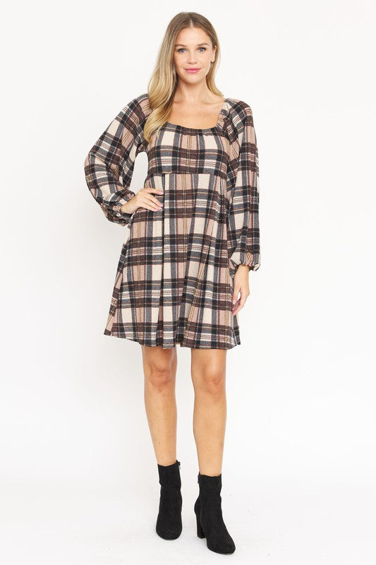 A woman in the Plaid Balloon Sleeve Midi Dress, featuring a square neckline and crafted from polyester spandex, is smiling and standing against a light background. Made in the United States.