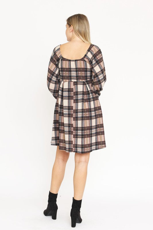 A woman in the Plaid Balloon Sleeve Midi Dress, featuring a square neckline and crafted from polyester spandex, is smiling and standing against a light background. Made in the United States.