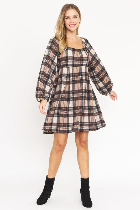 A person is wearing the Plus Plaid Balloon Sleeve Midi Dress, which features a red, yellow, and white plaid pattern with long balloon sleeves and a square neckline, crafted from a soft Polyester Spandex blend.