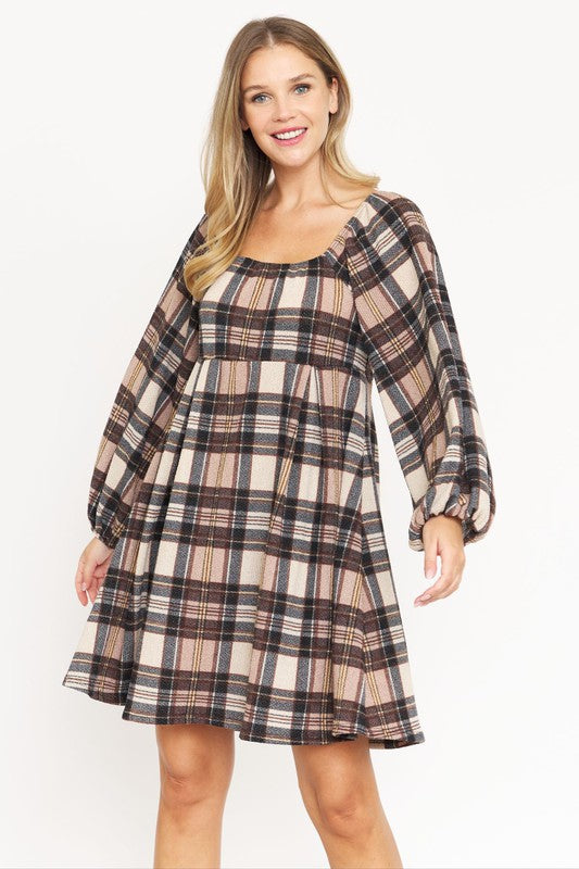 A person is wearing the Plus Plaid Balloon Sleeve Midi Dress, which features a red, yellow, and white plaid pattern with long balloon sleeves and a square neckline, crafted from a soft Polyester Spandex blend.